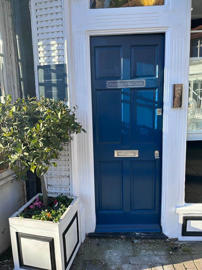 Wimbledon ear clinic sign on blue door