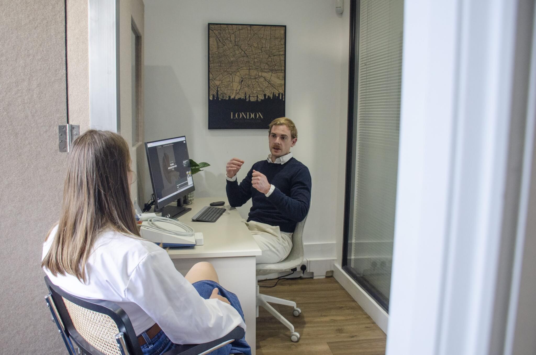 Dylan in his office chatting to patient 2